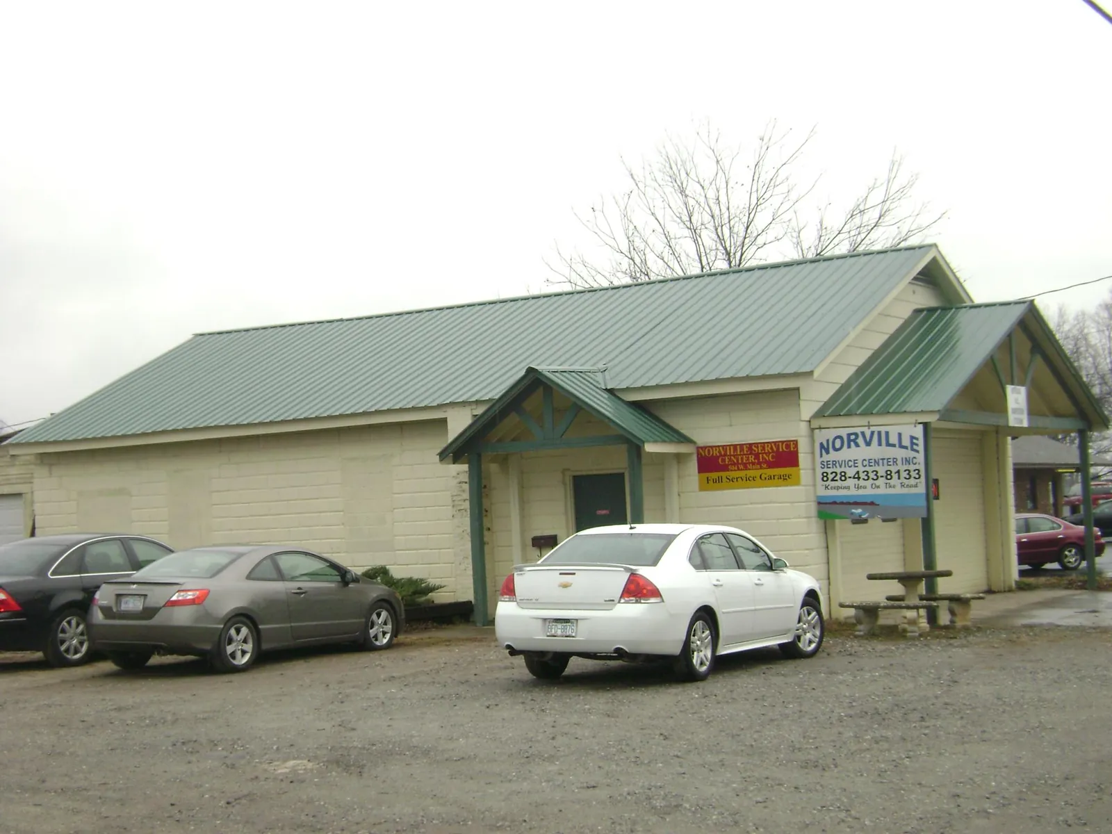 Green metal roof on a service garage with a covered entry in Indian Valley